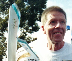 Tony Rafferty with Olympic Torch